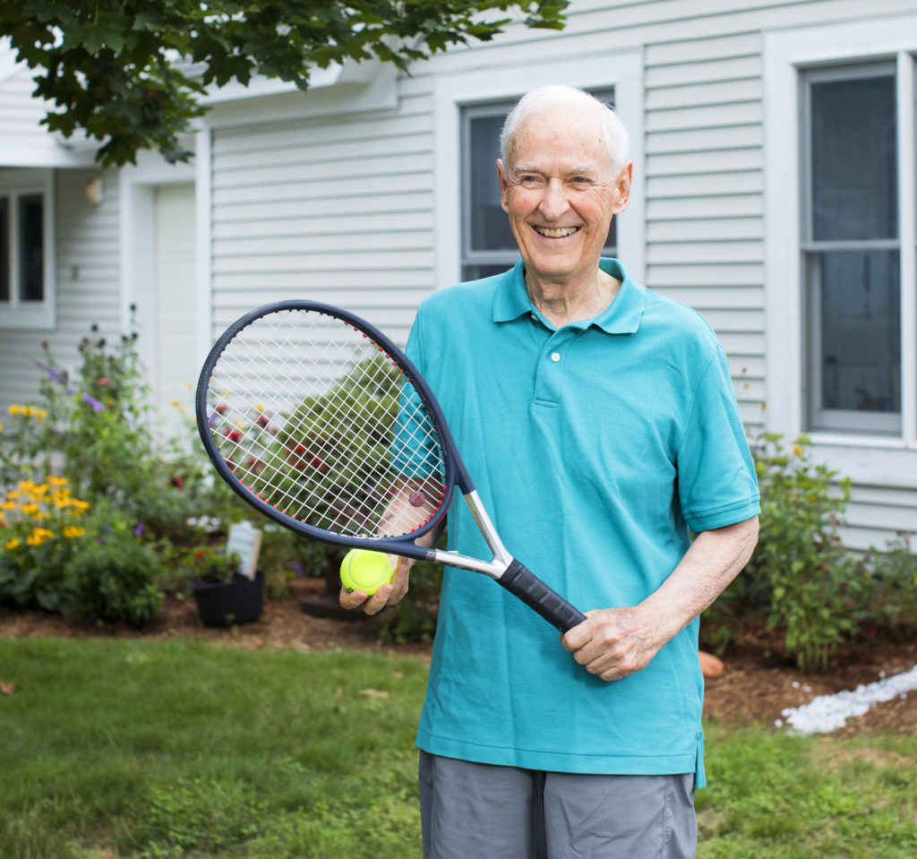 resident with tennis racket